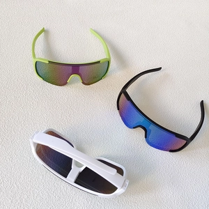 Outdoor kids sports sunglasses with large colorful lenses in neon, black, and white frames