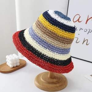 Close-up of the woven straw texture and multi-color rainbow stripes on the bucket hat