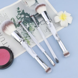 Dual-ended marble makeup brush set with foundation brushes and pink blush compact