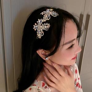 Close-up of sparkling butterfly headband with high-quality rhinestones on a female model