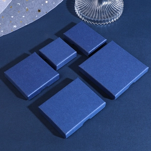 Navy blue textured jewelry boxes in various sizes featuring elegant star-patterned gauze