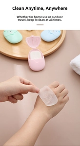 Detail of portable egg-shaped cases for mini disposable bear-shaped paper soap sheets