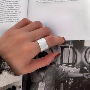 925 Sterling silver wide band ring with woven texture displayed on a model hand