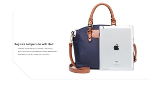 Deep blue nylon tote bag compared with an iPad to show the large internal storage capacity