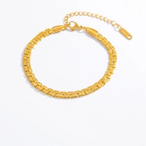 Detailed macro of golden stainless steel hollow Cuban chain with lobster clasp