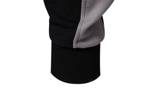 Close-up of black and grey contrast ribbed knit cuffs on casual sports sweatshirt