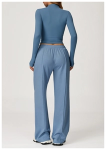 Back view of blue high-waist wide-leg sweatpants and long-sleeve crop top set