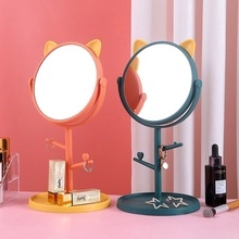 Desktop vanity mirror with cat ears design, storage tray, and jewelry hooks for students