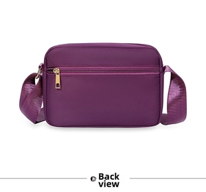 Rear view of purple oxford fabric shoulder bag showing back zipper pocket and silky strap
