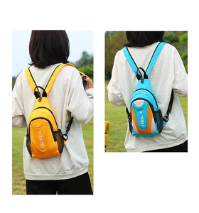 Outdoor leisure chest bags in yellow and blue-orange colors on nature background