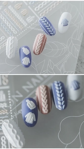 Detailed macro view of 3D embossed knitting patterns for autumn winter nail art stickers
