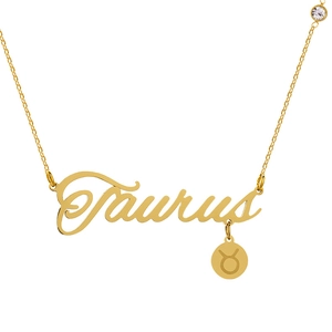 Close-up of golden Taurus letter necklace with zodiac charm and small white zircon