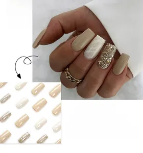 French style square press-on nails featuring marble texture and gold glitter accents