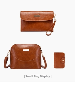 Close-up of tan PU leather shell bag set with gold hardware and distressed texture