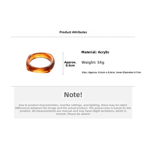 Detail view of amber resin acrylic bangle with dimensions 8.6cm and inner diameter 6.7cm