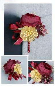 Detail of burgundy silk peony boutonniere with golden metal flower and red ribbon accent