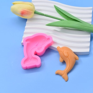 Detail of pink silicone dolphin mold BK-6043 with orange whale cake topper model