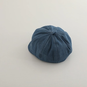 Deep blue denim newsboy cap for boys with vintage white contrast stitching and top button