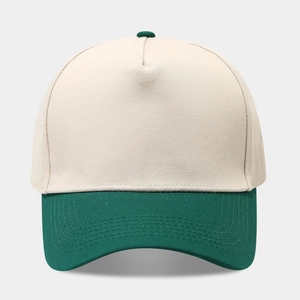 Close-up of a two-tone baseball cap with beige crown and forest green visor