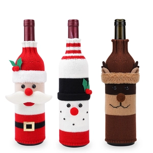 Knitted Christmas wine bottle covers featuring Santa, snowman and reindeer designs