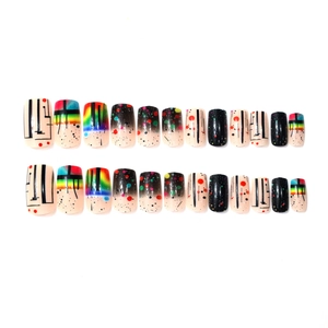 Artistic square press-on nails with abstract black lines and colorful polka dots patterns