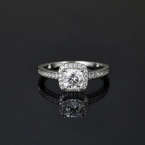 Elegant platinum plated moissanite ring with square cut main stone and micro-pave diamonds