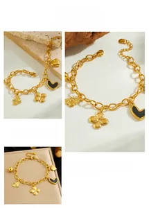 Detailed views of a gold-plated chain bracelet with black heart and bee charms