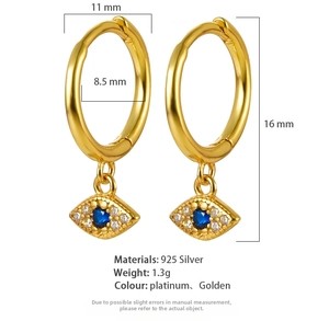 Detail of gold evil eye hoop earrings in S925 silver with blue crystal and white zircons