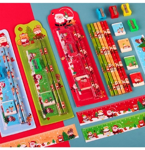Close-up of Christmas stationery set featuring Santa, reindeer pencils and cute erasers