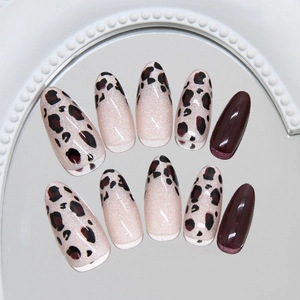 French almond press on nails featuring hazelnut leopard cat eye and deep red brown finish