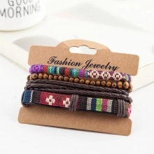 Detail of multi-layer leather bracelet set with woven texture and wooden beads