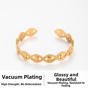 Detailed close-up of golden leaf design open bracelet with vacuum plating finish