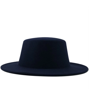 Detailed view of the dark blue wool felt flat top fedora with neat stitching and brim
