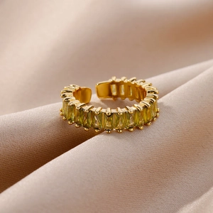 Adjustable gold open ring with rectangle emerald green zircons on champagne silk