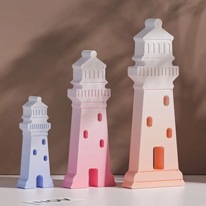 Three-piece lighthouse resin molds in pastel tones with natural sunlight shadows
