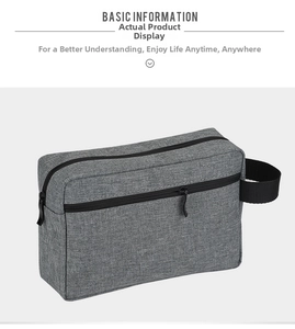Close-up of durable gray Oxford fabric digital organizer with side handle and dual zippers