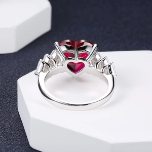 Luxurious S925 silver ring featuring a large red heart gemstone and white side stones