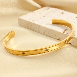Minimalist 18K gold plated stainless steel bangle with star zircon design
