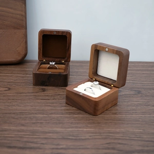 Detail of premium walnut wood jewelry box with magnetic lid and velvet lining for rings