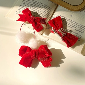 Red velvet bow hair clips with white pom-poms and gold crown for New Year kids
