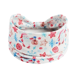 Detailed flat lay of a white elastic yoga headband with festive ghost and pumpkin prints