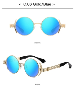 Macro detail of round punk sunglasses with gold metal frame and blue reflective lenses