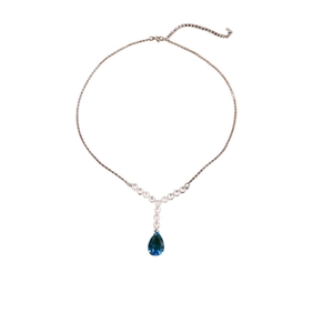Silver necklace with zircons and teardrop-shaped dark blue gemstone on white background