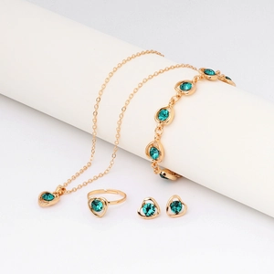 Gold crystal jewelry set with emerald heart-shaped necklace bracelet ring and earrings