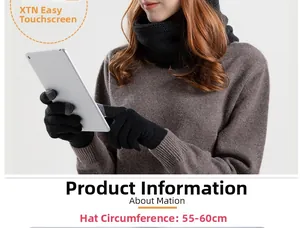 Close-up of touch-screen knit gloves and matching scarf on a model using a tablet