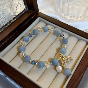 Blue gemstone bead bracelet with golden hollow pendant and freshwater pearl detail
