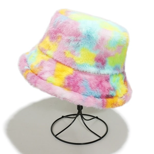Close-up of rainbow tie-dye faux fur bucket hat with soft plush texture on a display stand