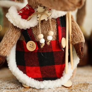 Plush Christmas reindeer doll with red plaid apron and wooden snowflake buttons