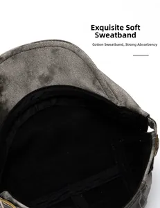 Close-up of internal cotton sweatband on a vintage dark grey textured newsboy cap