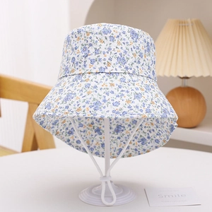 Detail of floral kids sun hat with adjustable chin strap and breathable cotton fabric